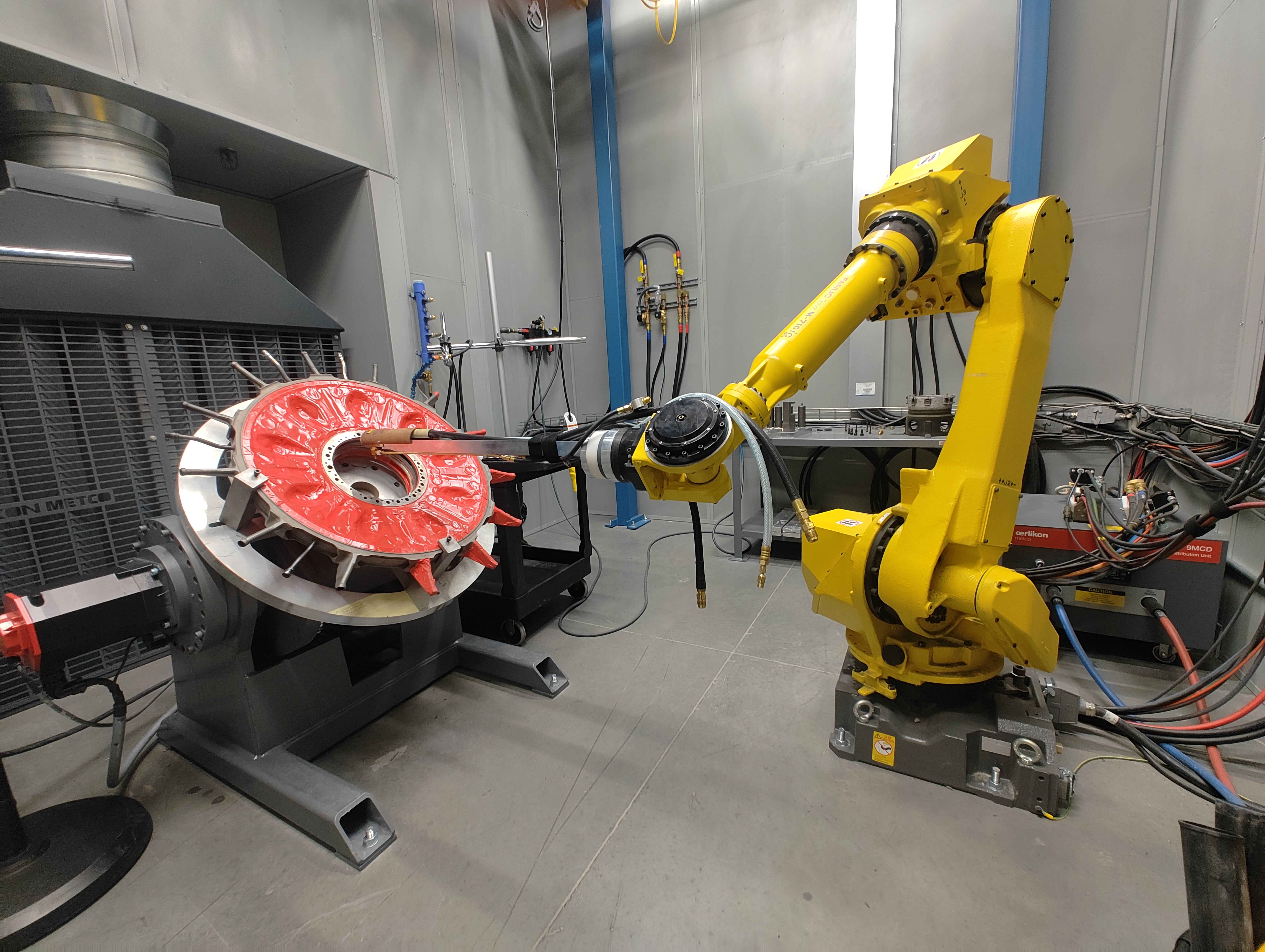 Fanuc arm servicing turbine part